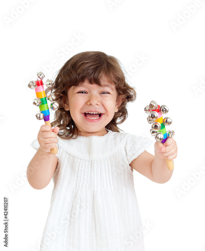 Photo: emotional child playing with musical toy emotional child playing with musical toy