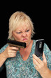 Mature Blonde Woman with Cell Phone and a Handgun (1)