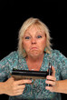 Mature Blonde Woman with Cell Phone and a Handgun (4)