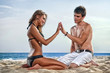 happy couple enjoying vacations on the beach