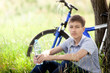 The cyclist in the park drinking clean water