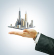 Foto: Business city center on businessman hand Business city center on businessman hand