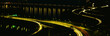 Photo: This is the Theodore Roosevelt Bridge over the Potomac River at night. There are streaked lights from the cars on the freeway and reflections from the lights on the road in the river. This is the Theodore Roosevelt Bridge over the Potomac River at night. There are streaked lights from the cars on the freeway and reflections from the lights on the road in the river.