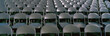 Photo: These are empty, grey folding chairs awaiting the crowd to attend the U.S. Naval Academy, Graduation Ceremony. They are neatly set up in rows side by side. These are empty, grey folding chairs awaiting the crowd to attend the U.S. Naval Academy, Graduation Ceremony. They are neatly set up in rows side by side.