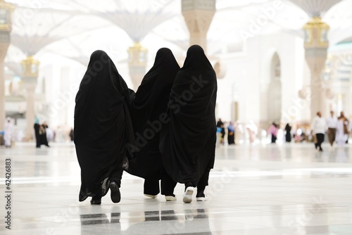 Photo: Three Moslim women walking outdoors Three Moslim women walking outdoors