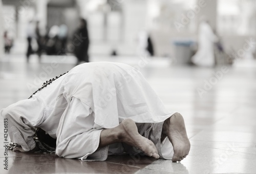 Photo: Muslim praying at Medina mosque Muslim praying at Medina mosque
