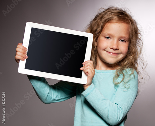 Foto: Happy girl with tablet computer Happy girl with tablet computer