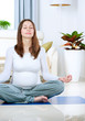 Beautiful Pregnant Woman Doing Yoga at Home