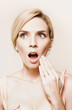Toned portrait of woman reacting in horror