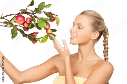 Foto: lovely woman with apple twig lovely woman with apple twig