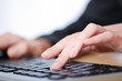 Foto: Hands typing on the keyboard Hands typing on the keyboard