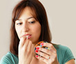 Photo: Young woman applying makeup Young woman applying makeup