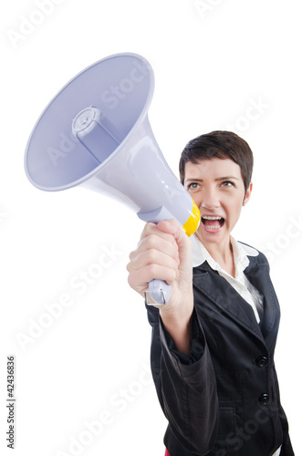 Photo: Young business lady screaming to loudspeaker Young business lady screaming to loudspeaker