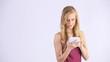 Video: smiling blonde girl uses a calculator smiling blonde girl uses a calculator