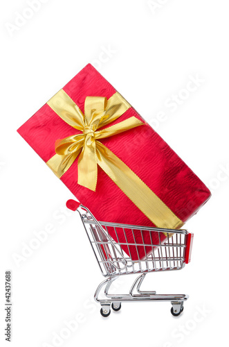 Photo: Giftbox and shopping cart on white Giftbox and shopping cart on white