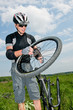 Cyclist mends wheel