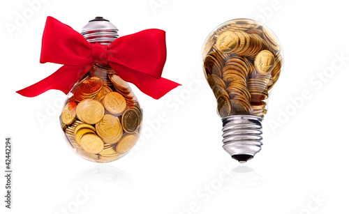 Photo: Traditional glass bulb with many golden coins Traditional glass bulb with many golden coins