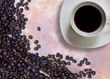 Photo: Coffee cup and grain on background Coffee cup and grain on background