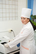 Doctor working with Biochemistry Analyzer