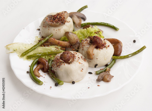 Photo: Appetizing pelmeni with fried fungi Appetizing pelmeni with fried fungi