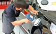 The man is polishing the car.