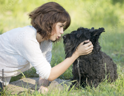 Photo: The girl talks to a dog The girl talks to a dog