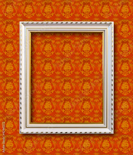 Photo: frame on yellow wallpaper with clipping path frame on yellow wallpaper with clipping path