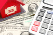 toy house, calculator and money.