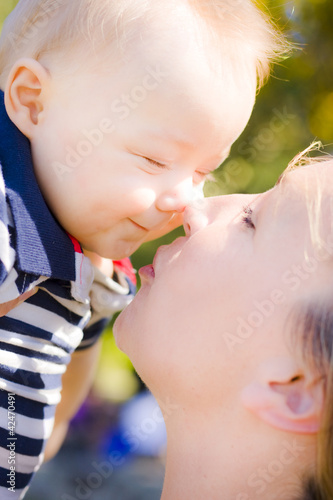 Photo: Joyful baby rubbing noses with Mom Joyful baby rubbing noses with Mom