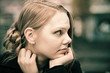 Pensive young blond woman