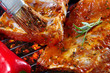 raw pork ribs on grill