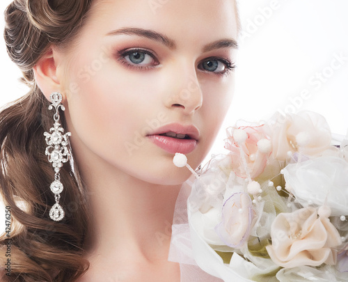 Photo: Portrait of beautiful young bride isolated on white background Portrait of beautiful young bride isolated on white background