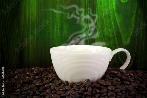 Photo: Cup of coffee and coffee beans. Cup of coffee and coffee beans.