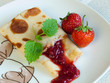 Rolled pancakes with strawberries