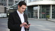 Mann with phone holding thumbs up