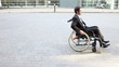 Handicapped business man using wheelchair