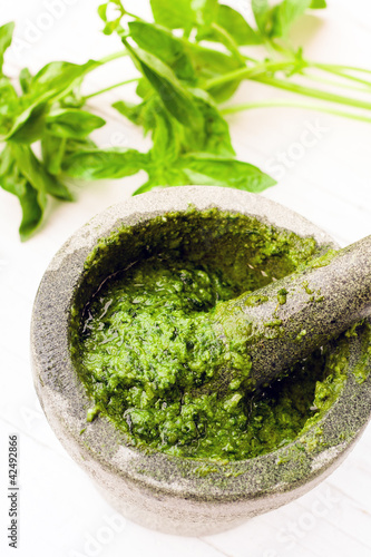 Photo: Homemade Pesto in mortar and pestle Homemade Pesto in mortar and pestle