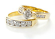 Two styles of golden ring with diamond isolated on white backgro