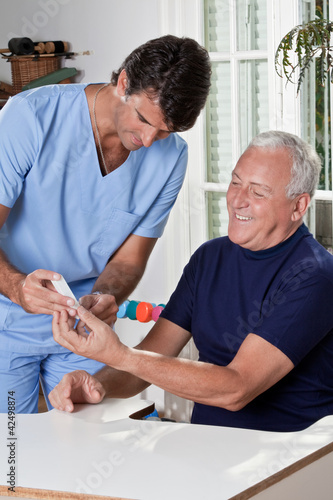 Foto: Doctor taking a Blood Sample Doctor taking a Blood Sample