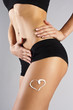 Woman applying moisturizer cream on legs. Perfect female figure