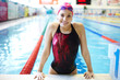 Photo: Portrait of a beautiful girl in a red cap at the swimming pool Portrait of a beautiful girl in a red cap at the swimming pool