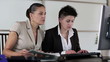 Portrait of two smiling businesswomen in the office