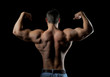 Foto: Bodybuilder showing his muscles Bodybuilder showing his muscles