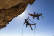Climbing team struggles to the summit.