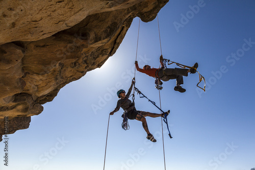 Photo: Climbing team struggles to the summit. Climbing team struggles to the summit.
