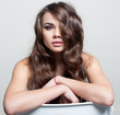 Sexy brunette woman with fancy hairstyle