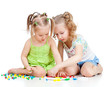 two kids sisters paly together, isolated on white background