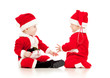 two funny small kids in Santa Claus clothes isolated on white ba
