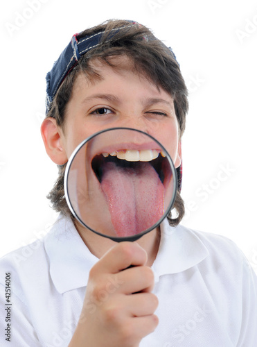 Photo: boy looking through a magnifying glass boy looking through a magnifying glass