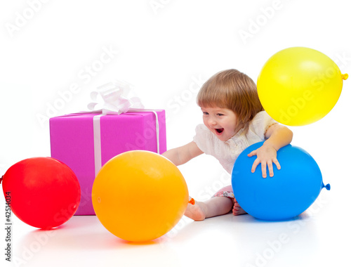 Photo: girl with colorful balloons and gift. Isolated on white. girl with colorful balloons and gift. Isolated on white.